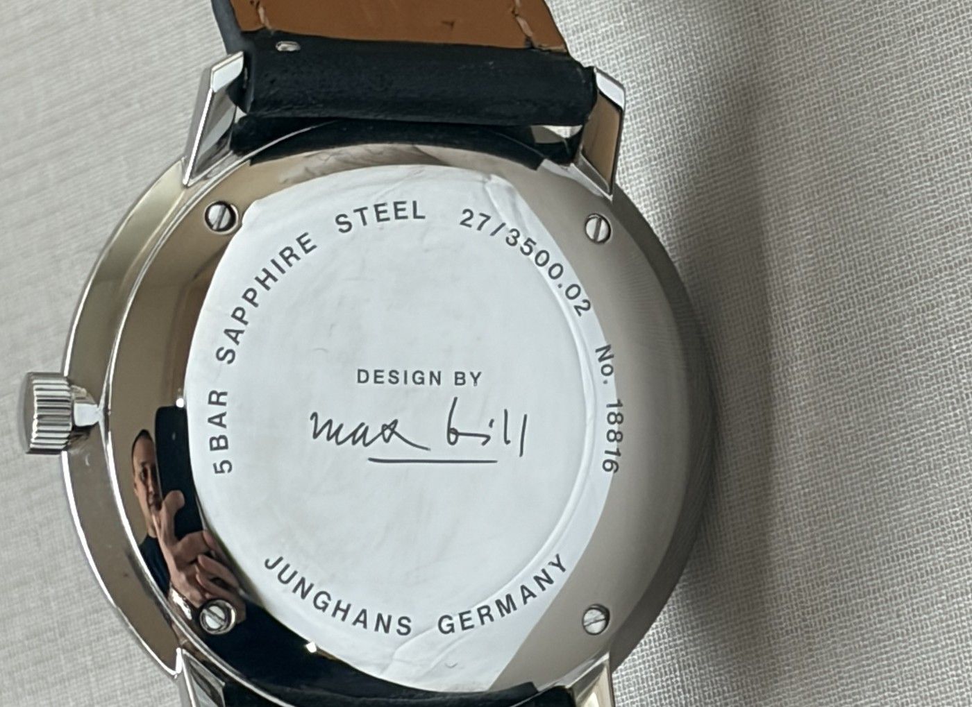 The caseback of my own example: reference, serial number and the signature.